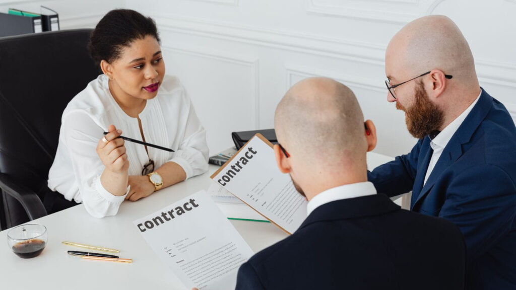 Legal professionals discussing about contract management